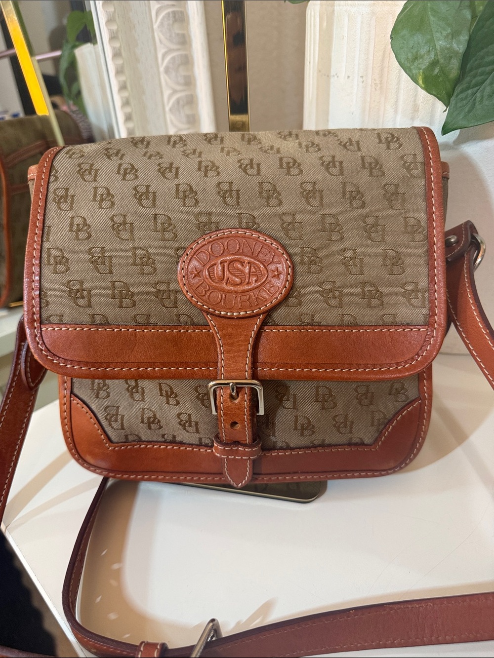 Vintage Dooney & Bourke Brown Canvas saddle bag.